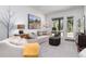 Inviting living room featuring neutral tones, comfortable seating, and a view of the outdoors through the window and glass door at 2250 Highlands Dr, Breckenridge, CO 80424