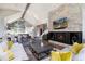 Open concept living room featuring a stone fireplace, and vaulted ceiling with beam at 2250 Highlands Dr, Breckenridge, CO 80424