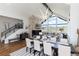 Spacious living and dining areas flow together, featuring modern lighting and large windows at 2250 Highlands Dr, Breckenridge, CO 80424