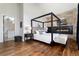 Spacious main bedroom boasts fireplace and four poster bed at 2250 Highlands Dr, Breckenridge, CO 80424