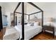 The beautiful main bedroom showcases a luxury bed with two nightstands and a bench at 2250 Highlands Dr, Breckenridge, CO 80424
