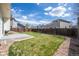 Well maintained backyard featuring a lawn, concrete patio and a wood fence at 9960 Kline St, Broomfield, CO 80021