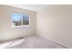 Well-lit bedroom featuring plush carpet, window and a neutral color scheme at 9960 Kline St, Broomfield, CO 80021