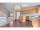 Bright kitchen with a center island, light cabinets, and modern lighting fixture at 9960 Kline St, Broomfield, CO 80021