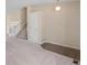 Spacious living room with staircase, carpeted floors, and neutral walls, offering a blank canvas at 9960 Kline St, Broomfield, CO 80021