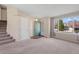 Bright living room with carpet floors and large window for natural light at 9960 Kline St, Broomfield, CO 80021