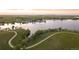Scenic aerial view showcasing the lake, recreational amenities, and walking trails within the community at 26530 E Euclid Pl, Aurora, CO 80016