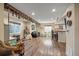 Spacious basement with wood floors, multiple seating areas, bar with counter seating, and an entertainment area at 26530 E Euclid Pl, Aurora, CO 80016