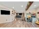 Finished basement with wood beam, study, and media room at 26530 E Euclid Pl, Aurora, CO 80016