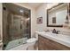 Modern bathroom with a walk-in shower, stylish vanity, and neutral decor at 26530 E Euclid Pl, Aurora, CO 80016