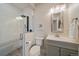 Modern bathroom featuring glass shower, and gray vanity at 26530 E Euclid Pl, Aurora, CO 80016