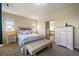 Cozy bedroom with natural light and en-suite bathroom with a relaxing tub at 26530 E Euclid Pl, Aurora, CO 80016