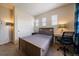 Bedroom with a work desk and a large closet at 26530 E Euclid Pl, Aurora, CO 80016