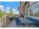 Back deck with a dining area, grill, and neighborhood views at 26530 E Euclid Pl, Aurora, CO 80016