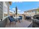 Outdoor deck with a seating area, grill, and neighborhood views at 26530 E Euclid Pl, Aurora, CO 80016