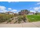Beautiful home featuring a landscaped yard, a covered patio, and a well-maintained lawn at 26530 E Euclid Pl, Aurora, CO 80016