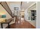 Open foyer leads to the living spaces and offers hardwood flooring and a staircase at 26530 E Euclid Pl, Aurora, CO 80016