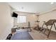 Home gym featuring weights, treadmill, and workout bench at 26530 E Euclid Pl, Aurora, CO 80016