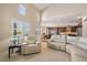 Spacious living area with a ceiling fan flowing into kitchen and dining space at 26530 E Euclid Pl, Aurora, CO 80016