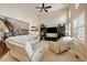Bright living room featuring tall ceilings, large windows, and comfortable seating at 26530 E Euclid Pl, Aurora, CO 80016