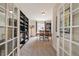 Home office featuring bookshelves and large window at 26530 E Euclid Pl, Aurora, CO 80016