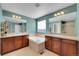 This bathroom has a soaking tub, double sinks, and warm lighting at 13457 Locust St, Thornton, CO 80602