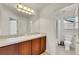 Bathroom vanity with double sinks and neutral tones at 13457 Locust St, Thornton, CO 80602