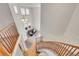 Cozy living room with a fireplace and a winding staircase leading up to the second floor at 13457 Locust St, Thornton, CO 80602