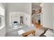 Spacious living room with staircase, bathed in natural light at 13457 Locust St, Thornton, CO 80602