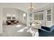 Sunlit living room featuring a cozy seating area at 13457 Locust St, Thornton, CO 80602