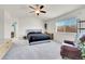 This main bedroom has a large window, ceiling fan, and stylish decor at 13457 Locust St, Thornton, CO 80602