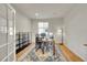 Home office with built-in shelving and hardwood floors at 13457 Locust St, Thornton, CO 80602