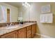 Elegant bathroom with double vanity, granite countertops, and ample storage, providing a luxurious feel at 10253 Fairgate Way, Highlands Ranch, CO 80126