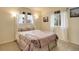 Serene bedroom featuring soft lighting, light walls, and tree-themed bedding, creating a peaceful retreat at 10253 Fairgate Way, Highlands Ranch, CO 80126