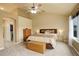 Serene bedroom featuring a comfortable queen bed, and large windows for natural light at 10253 Fairgate Way, Highlands Ranch, CO 80126