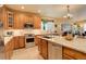 Kitchen featuring stainless steel appliances, granite countertops, and light tile backsplash at 10253 Fairgate Way, Highlands Ranch, CO 80126