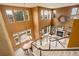 Aerial view of two-story living room featuring a fireplace and large windows for natural light at 10253 Fairgate Way, Highlands Ranch, CO 80126