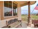 Charming porch with comfortable bench seating and views of the neighborhood, complemented by decorative accents at 10253 Fairgate Way, Highlands Ranch, CO 80126