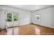 Bright bedroom with hardwood floors and French doors leading to the backyard at 2215 E 7Th Avenue Pkwy, Denver, CO 80206