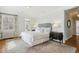 Comfortable bedroom features neutral tones, classic radiator and a large window with elegant window treatments at 2215 E 7Th Avenue Pkwy, Denver, CO 80206