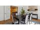 Formal dining room with a large table, seating for six, and a view of the kitchen through French doors at 2215 E 7Th Avenue Pkwy, Denver, CO 80206
