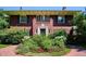 Charming brick home with a manicured front garden featuring a brick walkway at 2215 E 7Th Avenue Pkwy, Denver, CO 80206