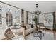 Sunlit living room with comfortable seating, large windows, and stylish decor at 2215 E 7Th Avenue Pkwy, Denver, CO 80206