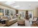 Open floor plan showcasing the living and dining areas with skylights, windows, and stylish furnishings at 2215 E 7Th Avenue Pkwy, Denver, CO 80206