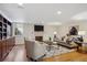 Cozy living room with fireplace, built-in shelving, plush seating, and a stylish area rug at 2215 E 7Th Avenue Pkwy, Denver, CO 80206