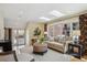 Sun-filled living room featuring skylights, large windows, and a comfortable seating area with a cozy rug at 2215 E 7Th Avenue Pkwy, Denver, CO 80206