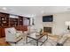 Cozy living room with fireplace, built-in shelving, plush seating, and a stylish area rug at 2215 E 7Th Avenue Pkwy, Denver, CO 80206