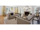 Bright living room with hardwood floors, sofas, fireplace, and windows with yellow drapes at 2215 E 7Th Avenue Pkwy, Denver, CO 80206