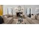 Cozy living room with a stone fireplace, decorative mirror, and sofas on an elegant rug at 2215 E 7Th Avenue Pkwy, Denver, CO 80206