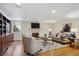 Inviting living room with fireplace, built-in shelves, hardwood floors, and ample seating at 2215 E 7Th Avenue Pkwy, Denver, CO 80206